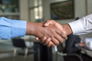 Two business brokers in tampa shaking hands