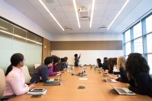 Tampa Business Brokers in the conference room looking at the person behind the board