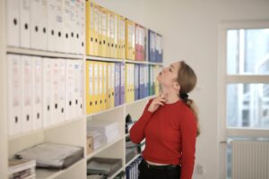 Woman looking at folders with documents in the office